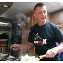 Steve cooking our tea wearing his Red Lizard t-shirt.